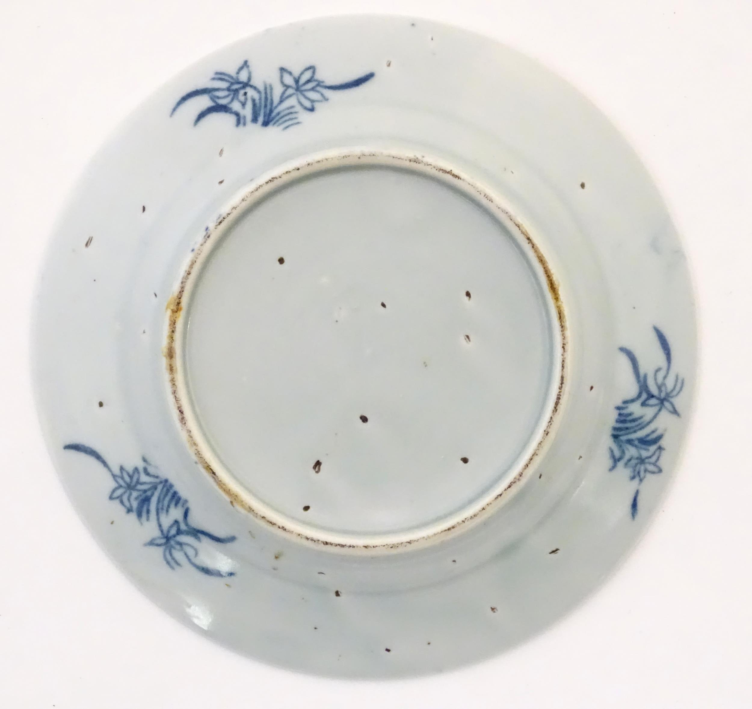 A Chinese blue and white plate depicting a landscape scene with figures, trees, pagodas etc. with - Image 2 of 3