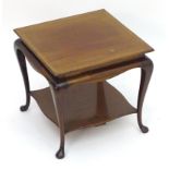 A small early 20thC mahogany table with a crossbanded top above four cabriole legs and pad feet. 16"