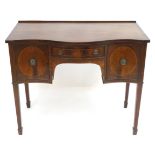 A Georgian style mahogany sideboard with a small upstand above a single short central drawer and