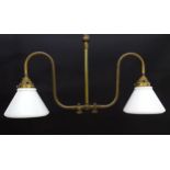 A twin branch light fitting with white glass conical shaped shades. Approx. 25" wide x 13" high