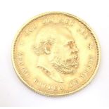 Coin: An 1876 Netherlands 10 Gulden gold coin depicting Willem III and coat of arms. Approx. 7/8"