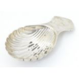 A silver caddy spoon with shell formed bowl, hallmarked Birmingham 1972, maker Turner & Simpson Ltd.