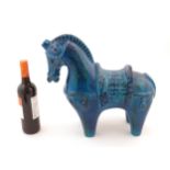 An Italian model of a stylised horse with a turquoise glaze, in Oriental manner, by Aldo Londi (