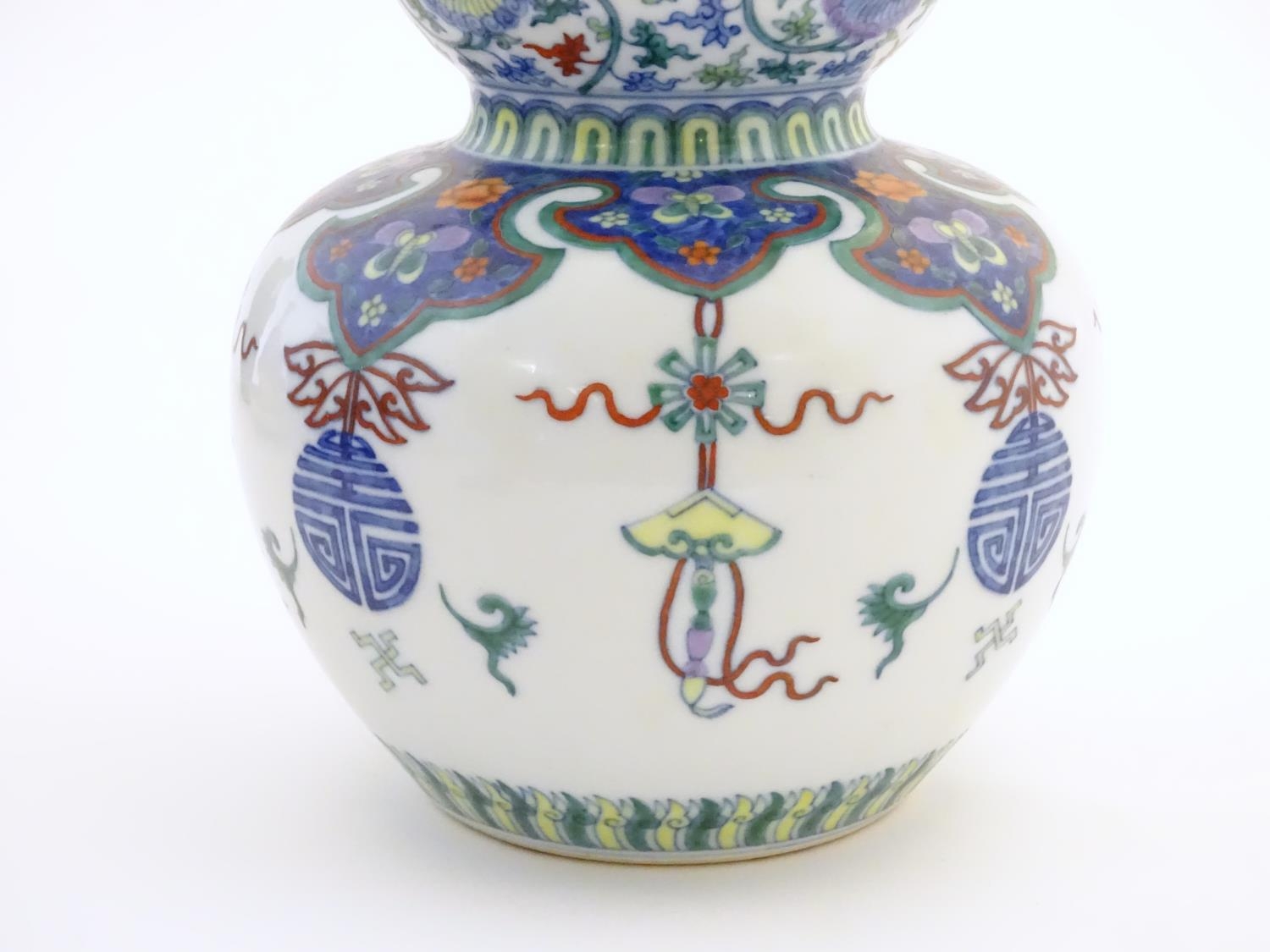 A Chinese double gourd vase with doucai style decoration with scrolling floral and foliate detail. - Image 9 of 16