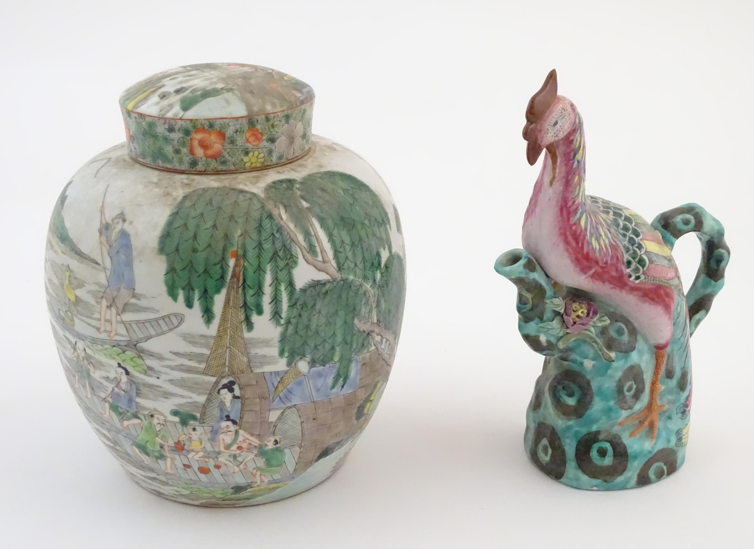 A Chinese ginger jar depicting a wooded river scene with figures on boats, to include men, women,