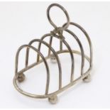 A silver five bar toast rack, hallmarked Birmingham 1927, maker Elkington & Co. Approx. 3 1/2"