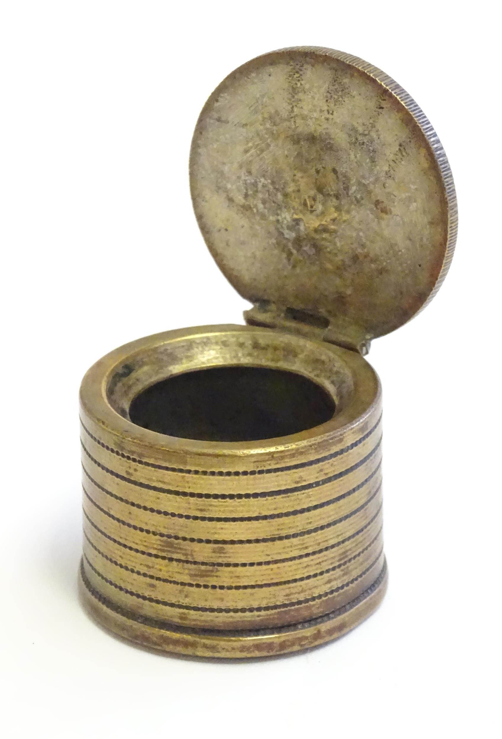A 20thC Continental cast inkwell modelled as stacked coins, with applied French coins to top. - Image 5 of 9