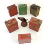 A collection of mid 20thC Shell two-gallon petrol cans with brass caps, variously marked Shell-Mex