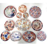 A quantity of assorted ceramics in the Imari palette, to include meat plates, chargers, plates,
