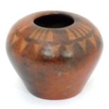 A terracotta studio pottery vase of squat form, stamped under GK Please Note - we do not make