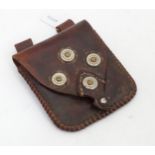 A small leather pouch Please Note - we do not make reference to the condition of lots within
