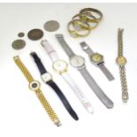 Assorted ladies wrist watches, together with a Victorian 1889 crown coin and a 1950 half crown coin.