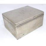 A German silver plate cigarette box with monogram to top. Approx. 6 3/8" wide Please Note - we do