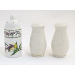 A Belleek salt and pepper with relief floral and foliate detail. Together with along with