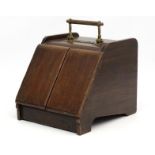 A Victorian patent oak and brass coal box with automatic lever opening hinged door. 16" high x 13