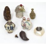 A quantity of Oriental snuff bottles to include ceramic, stone and shell examples. (7)