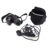 A Nikon D40 digital bridge camera with a DS zoom lens, charger, case, etc. Please Note - we do not