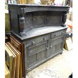 An oak court cupboard with carving to doors. Approx. 54" wide Please Note - we do not make reference