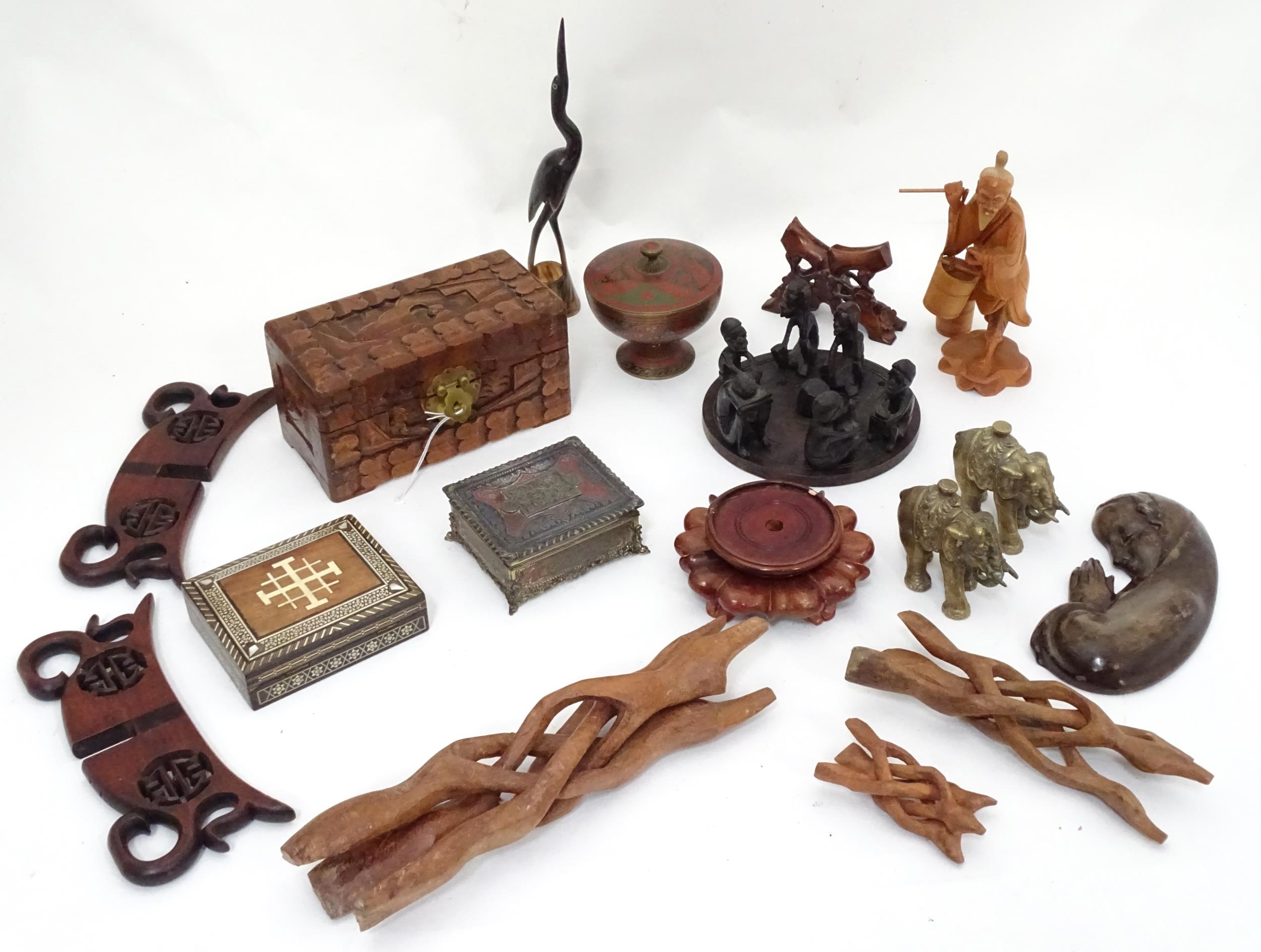 A quantity of carved Oriental items to include a sage figure, boxes, etc. Together with a