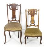 Two early 20thC side chairs with shaped top rails above tapered and pierced back splats with