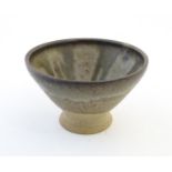 A studio pottery footed bowl with drip glaze detail. Marked under Quinlan Storrington. Approx. 3"