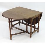 A mahogany gate leg table Please Note - we do not make reference to the condition of lots within