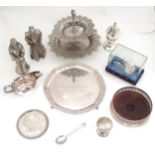 Assorted silver plated wares to include a salver, bottle coaster, figures, trays, etc . Please