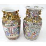 A pair of Oriental vases decorated with flowers, butterflies, etc. Character marks under. Please