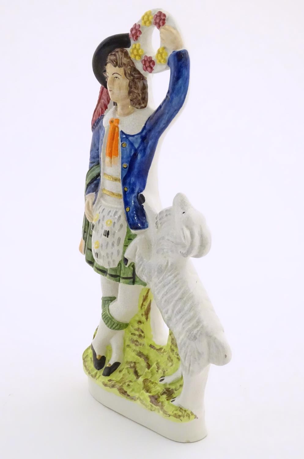 A Staffordshire pottery figure of a Highland man wearing a kilt with a sporran and a plume hat, - Image 3 of 6