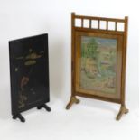An early 20thC oak fire screen with inset & glazed tapestry decoration, together with a Japanese