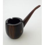 A 20thC wooden ashtray modelled as an oversized pipe. Approx. 8" long Please Note - we do not make