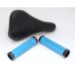 A Diamondback bicycle saddle together with a pair of handlebar grips Please Note - we do not make