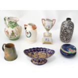 A quantity of ceramics to include an Austrian urn, a Wade tankard, hunting jug, etc. Please Note -