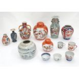 A quantity of Oriental ceramics to include vases in the Imari palette, Satsuma vases, etc. Please