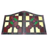 A pair of early 20thC lead and stained glass window / door panels, of irregular quadrilateral