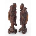 2 Carved Oriental figures (2) Please Note - we do not make reference to the condition of lots within