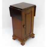 A mahogany bedside / pot cupboard with drop flap top Please Note - we do not make reference to the