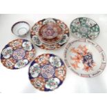 A quantity of assorted Oriental wares in the Imari palette with include chargers, bowls, plates