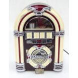 A novelty jukebox radio Please Note - we do not make reference to the condition of lots within