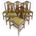 A set of six oak dining chairs with upholstered seats and Chippendale style back splats. Approx.