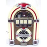 A novelty jukebox radio Please Note - we do not make reference to the condition of lots within