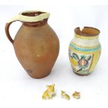 A 19thC terracotta jug, together with and 20thC vase and three models of dogs Please Note - we do