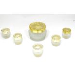 A set of 6 frosted glass and gilt dressing table pots Please Note - we do not make reference to