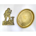 A brass tray and a brass plaque depicting a busker with a violin Please Note - we do not make