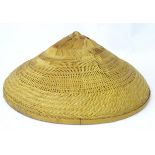A Far Eastern wicker hat Please Note - we do not make reference to the condition of lots within