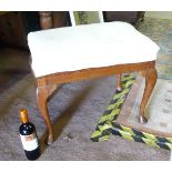 A walnut stool with cabriole legs. Approx. 23 3/4" wide Please Note - we do not make reference to