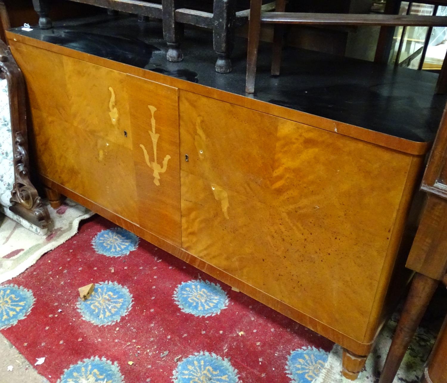 An Art Deco sideboard Please Note - we do not make reference to the condition of lots within