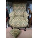 An upholstered armchair together with a footstool with matching upholstery (2) Please Note - we do