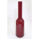 A modern Villeroy & Boch 'Nek' Polish glass bottle vase, red with white interior, the base stamped
