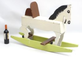 Rocking horse : a scratch built and painted wooden rocking horse on bows with brown painted back and